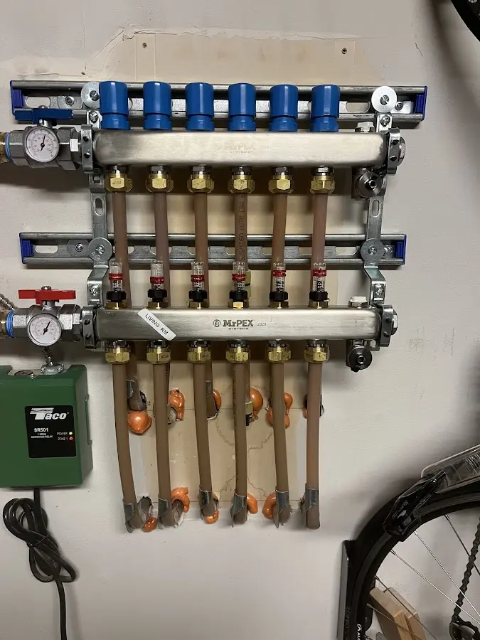 Plumber performing Water Heater Repair at a residential property in Ketchum